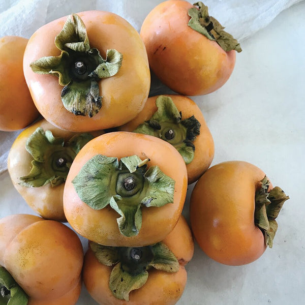 Persimmons piled up