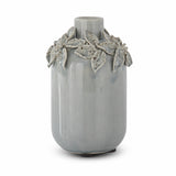Tall light blue ceramic vase with raised flowers and leaves