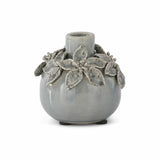 Wide light blue ceramic vase with raised flowers and leaves