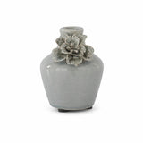 Light blue raised floral ceramic vases styled together