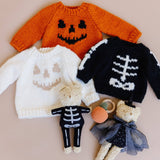 Cream Jack O Lantern Sweater in a Halloween clothing and toy arrangement, Stone Hollow Farmstead