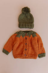 Pumpkin Cardigan styled with a green pom hat, Stone Hollow Farmstead