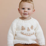 Child wearing the cream Jack O Lantern Sweater, Stone Hollow Farmstead