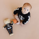 Skeleton Bear beside a child and pumpkin rattle, Stone Hollow Farmstead