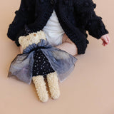Witch Bear beside a child in a black cardigan, Stone Hollow Farmstead