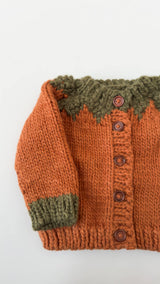 Pumpkin Cardigan sleeve and wooden button detail, Stone Hollow Farmstead