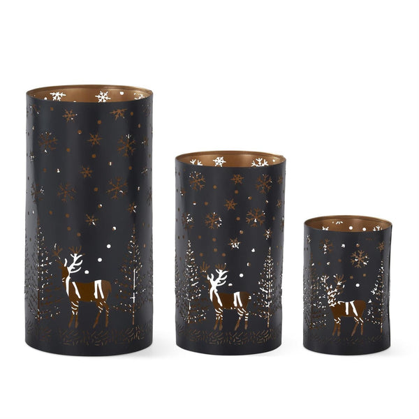 black metal cutout votive with trees and deer